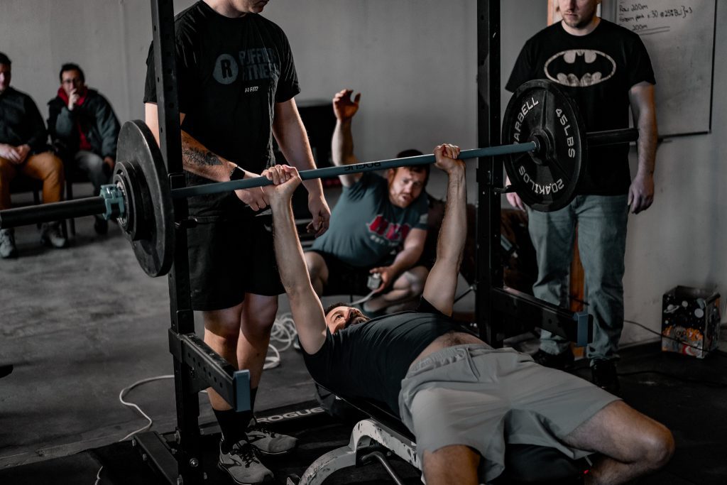 Man bench pressing in a power lifting competition