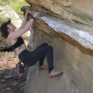 young caucasion woman rock climbing outdoors | Nutrition Coach Akron