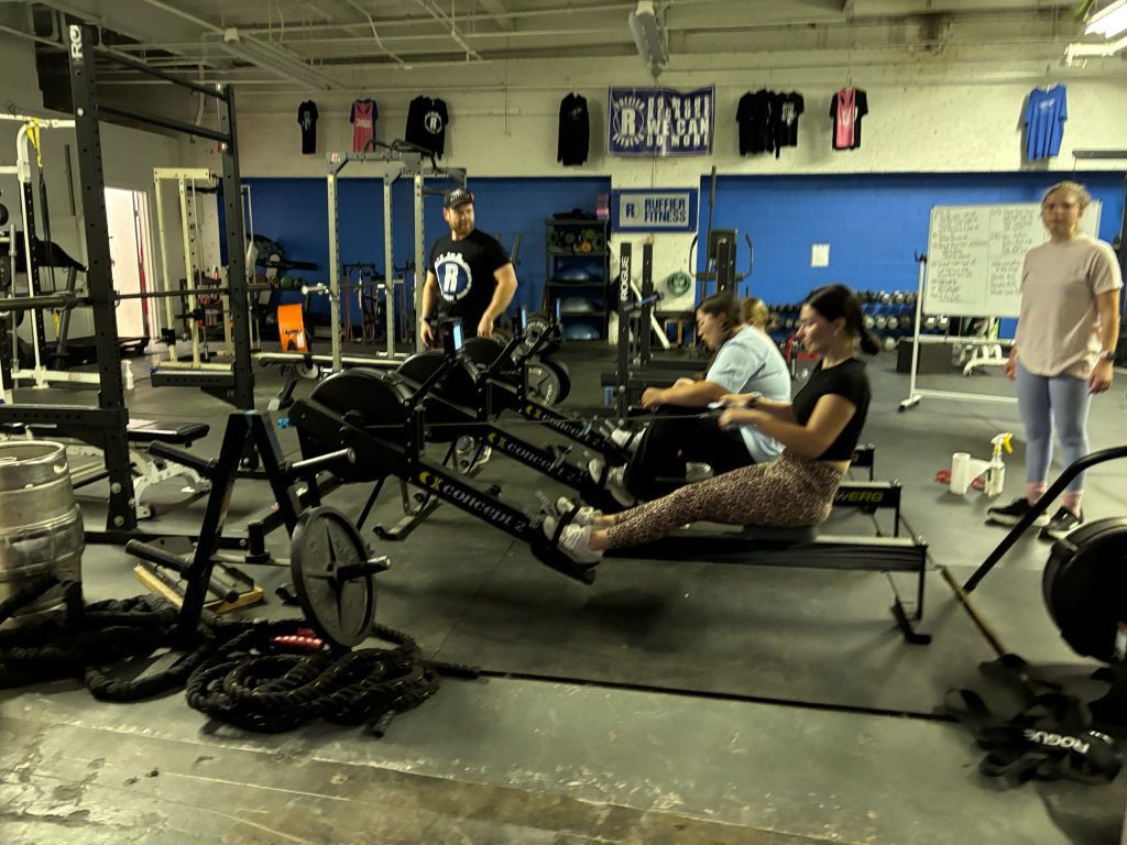 Rowing with a personal trainer in a group fitness class | Ruffier Fitness, Akron, Ohio