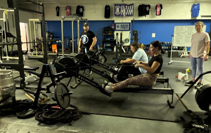 Rowing with a personal trainer in a group fitness class | Ruffier Fitness, Akron, Ohio